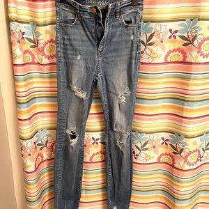 American Eagle ripped skinny jeans, high-waisted. Medium blue color.